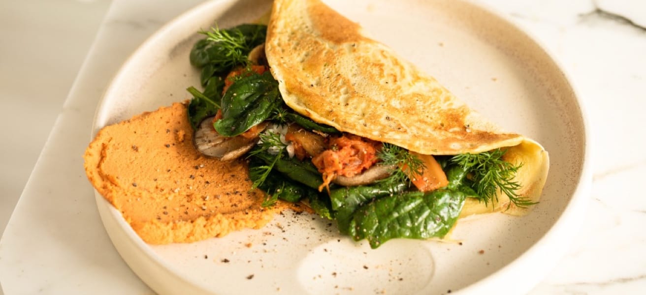 A delicious omelette with herbs and vegetables.